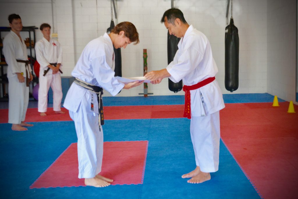 Sensei Sandra receiving 5th Dan & Shihan (master instructor) certificates, 2016.