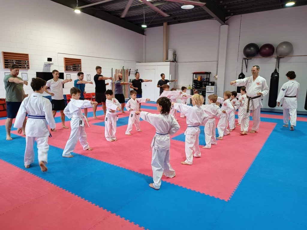Kids and parents training together in a Saturday class in the dojo