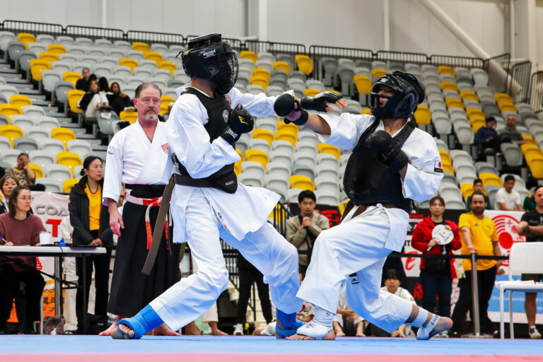 Kumite (sparring) action at a karate tournament